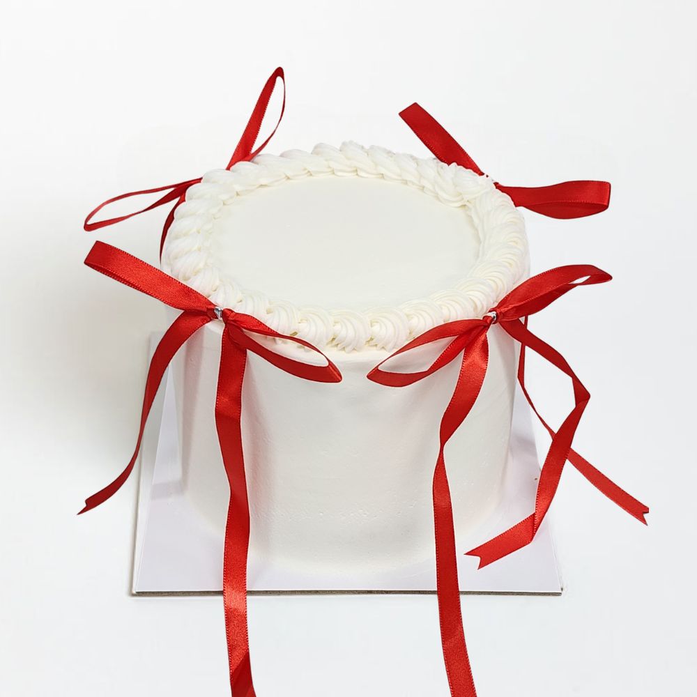 White Cake with RED BOWS