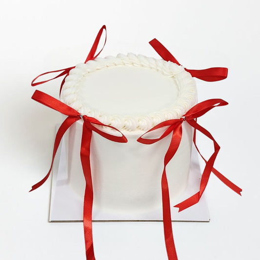 White Cake with RED BOWS